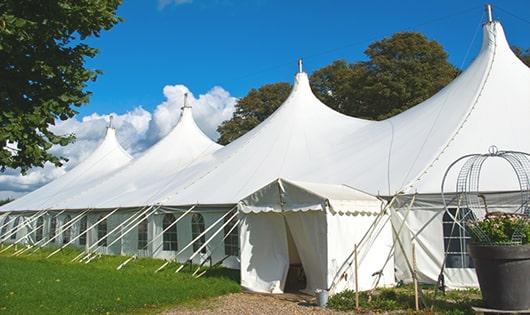 high-quality portable toilets stationed at a wedding, meeting the needs of guests throughout the outdoor reception in Gill